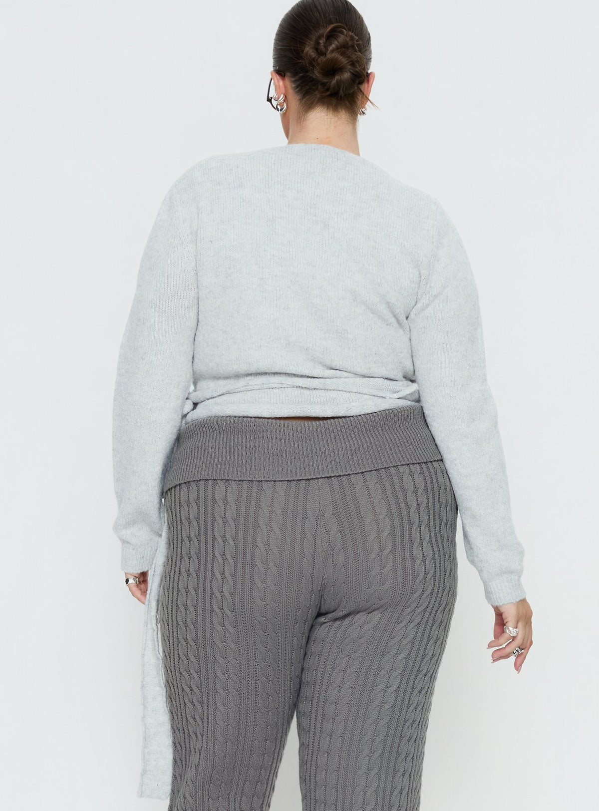Highlighting the Tonee Wrap Knit Cardigan Grey Curve in a short length womens jumper with v-neck and oversized fit back view of model wearing Princess Polly