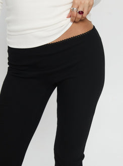 back view of model wearing Princess Polly Baseline Rib Capri Pants Black Tall Mid Rise Pants 