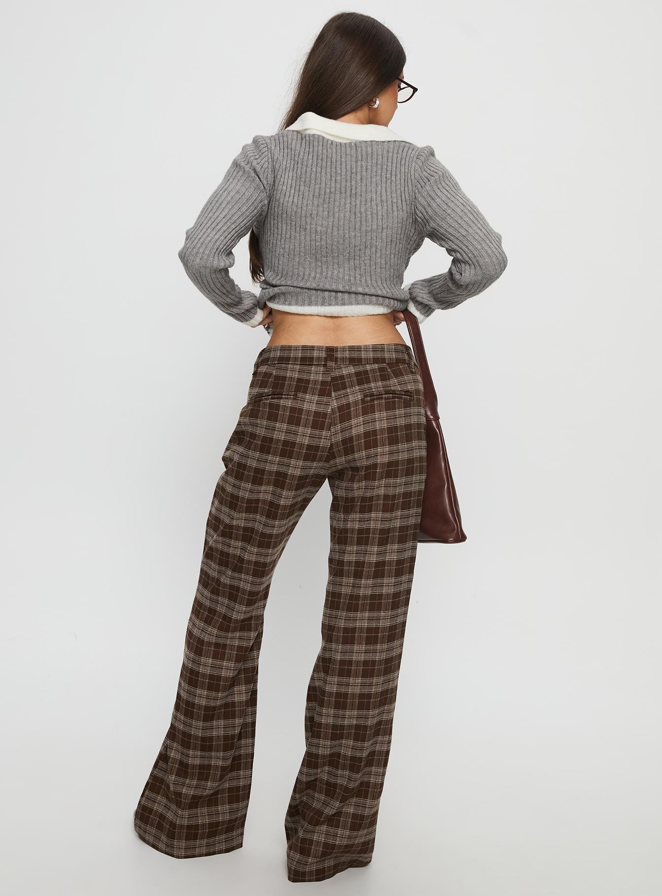 back view of model wearing Princess Polly Emiroki Straight Leg Pants Brown Check Mid Rise Pants 