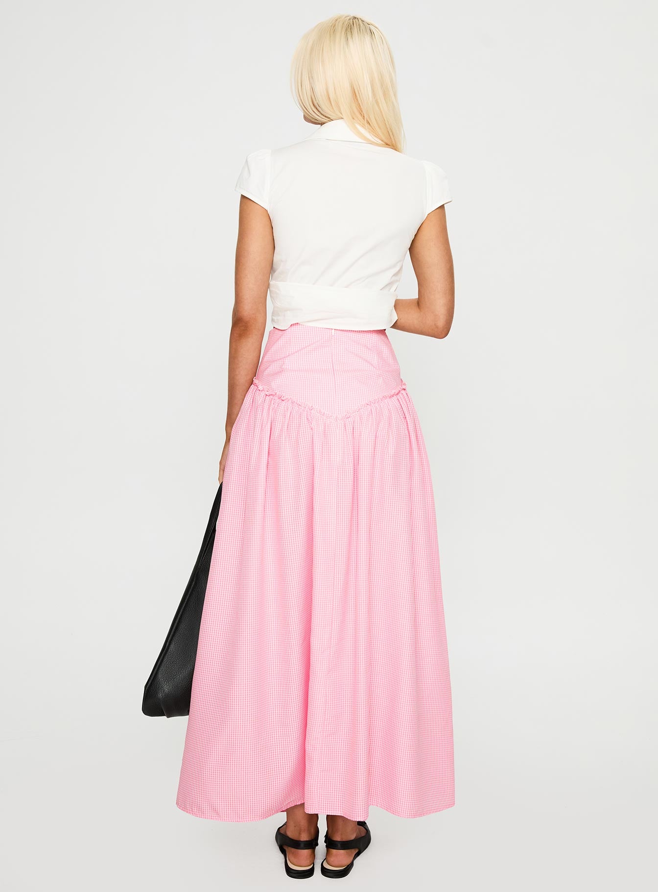back view of model wearing Princess Polly Apresia Maxi Skirt Pink Gingham Maxi 