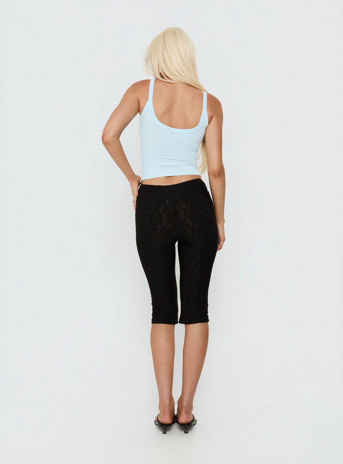 back view of model wearing Princess Polly Samaira Capri Pant Black Anglaise Mid Rise Pants 