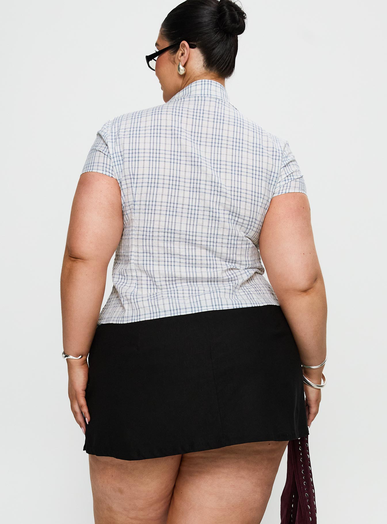back view of model wearing Princess Polly Can't Sleep Skort Black Curve Low Rise Shorts 