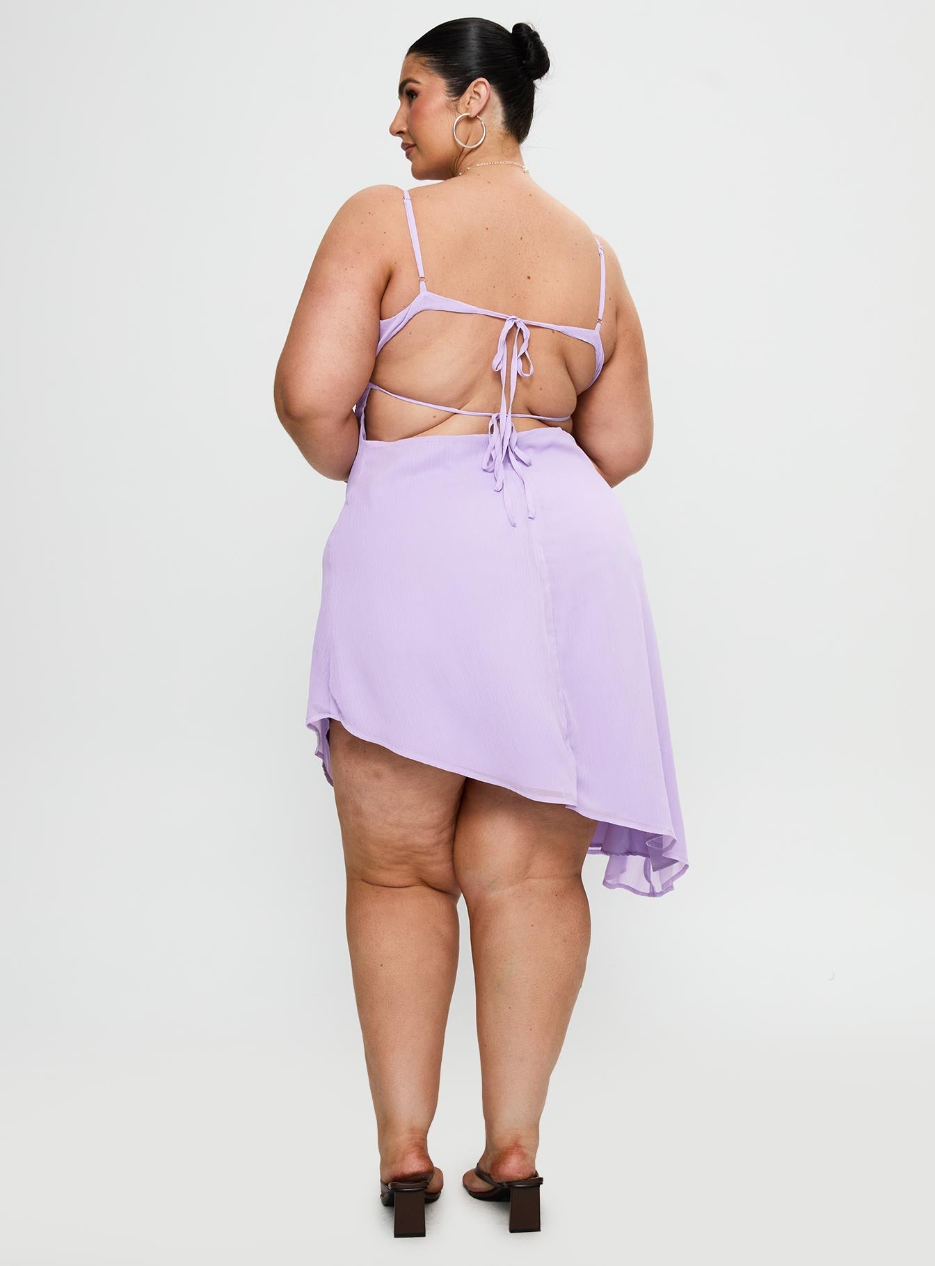 back view of model wearing Princess Polly Secret Gardens Asymmetrical Midi Dress Purple Curve Plunger 