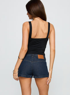 back view of model wearing Princess Polly Catch Me Now Denim Shorts Dark Blue Wash Low Rise Shorts 