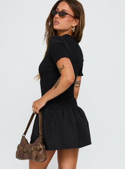 side view of model wearing Princess Polly Laurita Shirred Mini Dress Black High Neck 