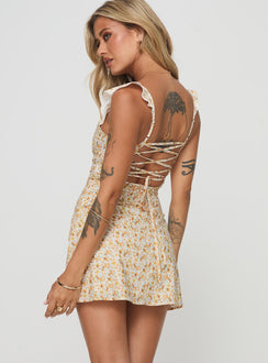 back view of model wearing Princess Polly Landon Mini Dress Yellow Floral Sweetheart Neckline 