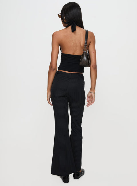 back view of model wearing Princess Polly Jinxed Pant Black Low Rise Pants Pants 