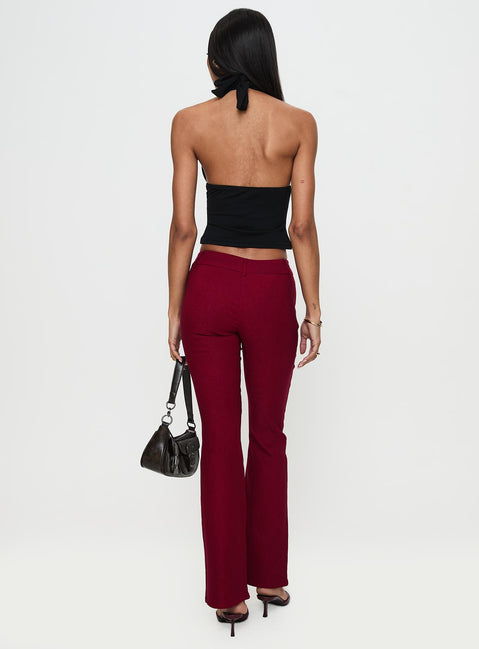 back view of model wearing Princess Polly Kinkirk Flared Pants Burgundy Low Rise Pants Pants 