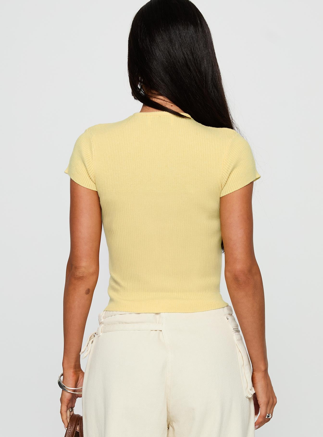 back view of model wearing Princess Polly Suzu Knit Top Lemon Short Sleeves Crew Neck 