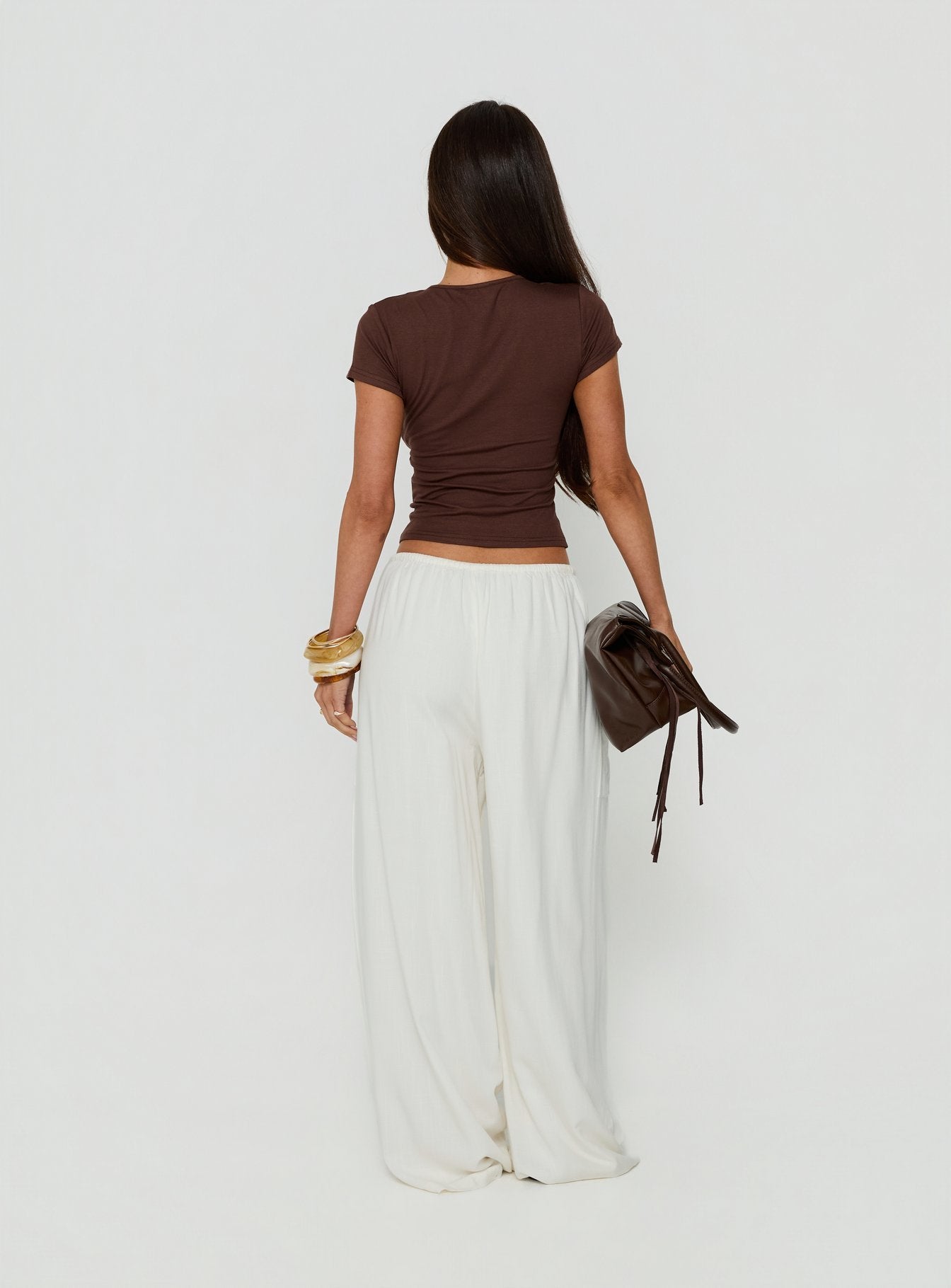 Designed with Peacemaker Tie Waist Relaxed Pants Off-White in womens regular pants featuring mid-rise waistline back view of model wearing Princess Polly