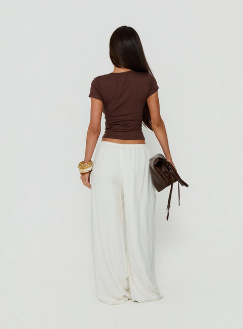Designed with Peacemaker Tie Waist Relaxed Pants Off-White in womens regular pants featuring mid-rise waistline back view of model wearing Princess Polly