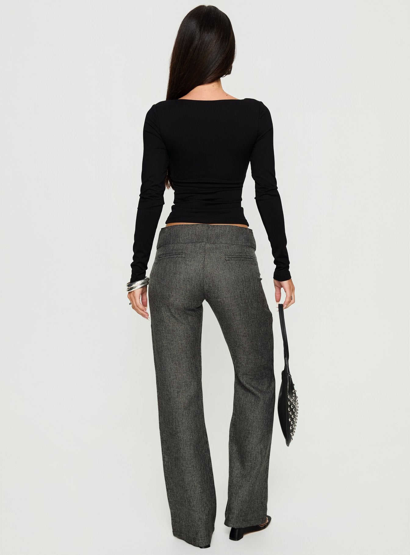 back view of model wearing Princess Polly Karola Asymmetrical Buckle Pants Grey Mid Rise Pants 