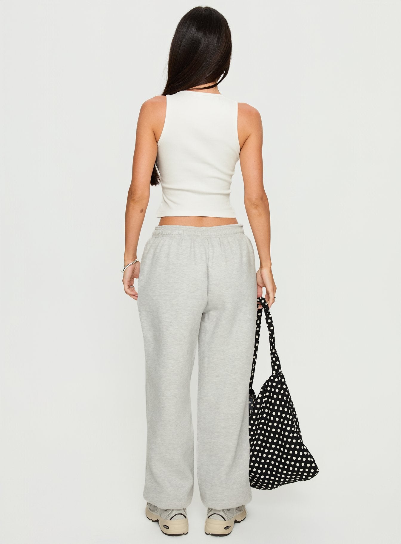 back view of model wearing Princess Polly Caspa Dream Fleece Oversized Ankle Cuff Jogger Grey Marle High Rise Pants 