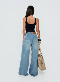 Presenting Naylor Mid Rise Wide Leg Jeans Light Wash Denim Light Blue Wash Petite in womens-jeans with mid-rise back view of model wearing