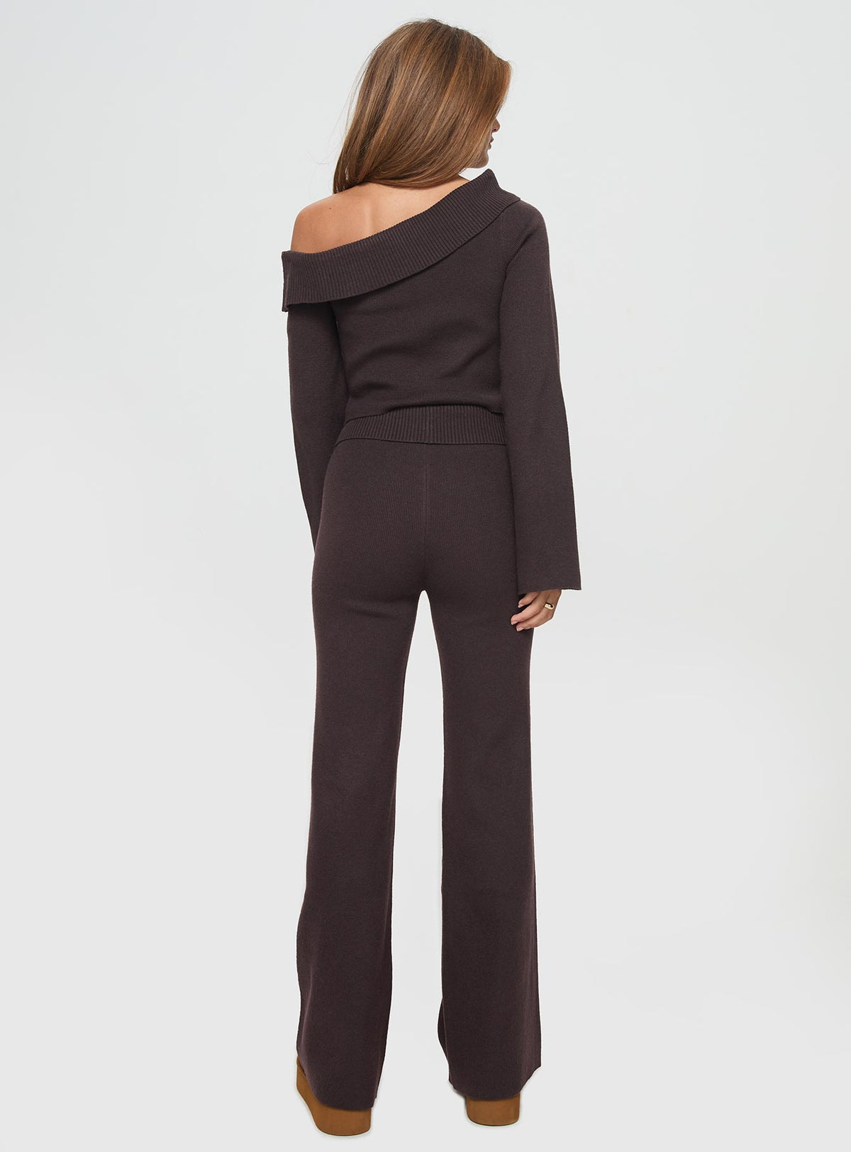back view of model wearing Princess Polly Sina Off The Shoulder Top Chocolate Full Sleeves Asymmetric Neckline 