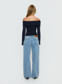 Highlighting Ellanor Low Rise Slouch Denim Jean Washed Mid Blue Wash Petite womens-jeans back view of model wearing Princess Polly