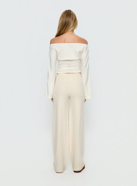 back view of model wearing Princess Polly Felisha Low Waist Knit Pants White Mid Rise Pants 