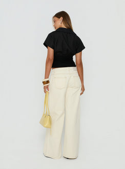 Presenting the Ramos Low Rise Wide Leg Jeans Cream in womens jeans with low-rise waist back view of model wearing Princess Polly