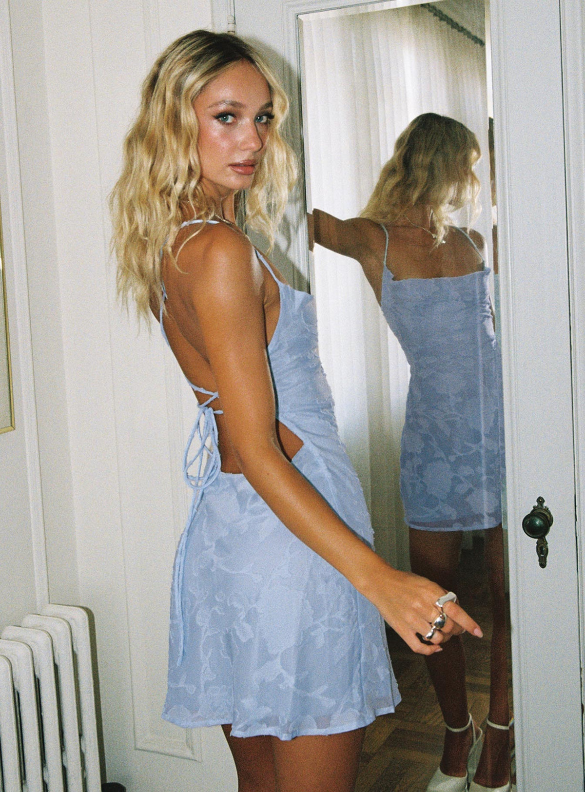 side view of model wearing Princess Polly Celena Mini Dress Light Blue Burnout Tall Cowl Neck 