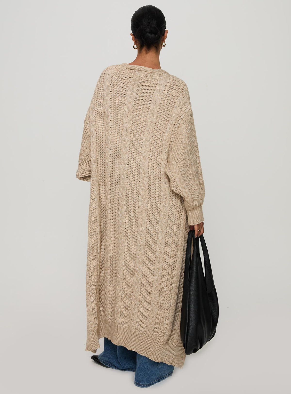 back view of model wearing Princess Polly Orkid Cable Knit Cardigan Beige Long 