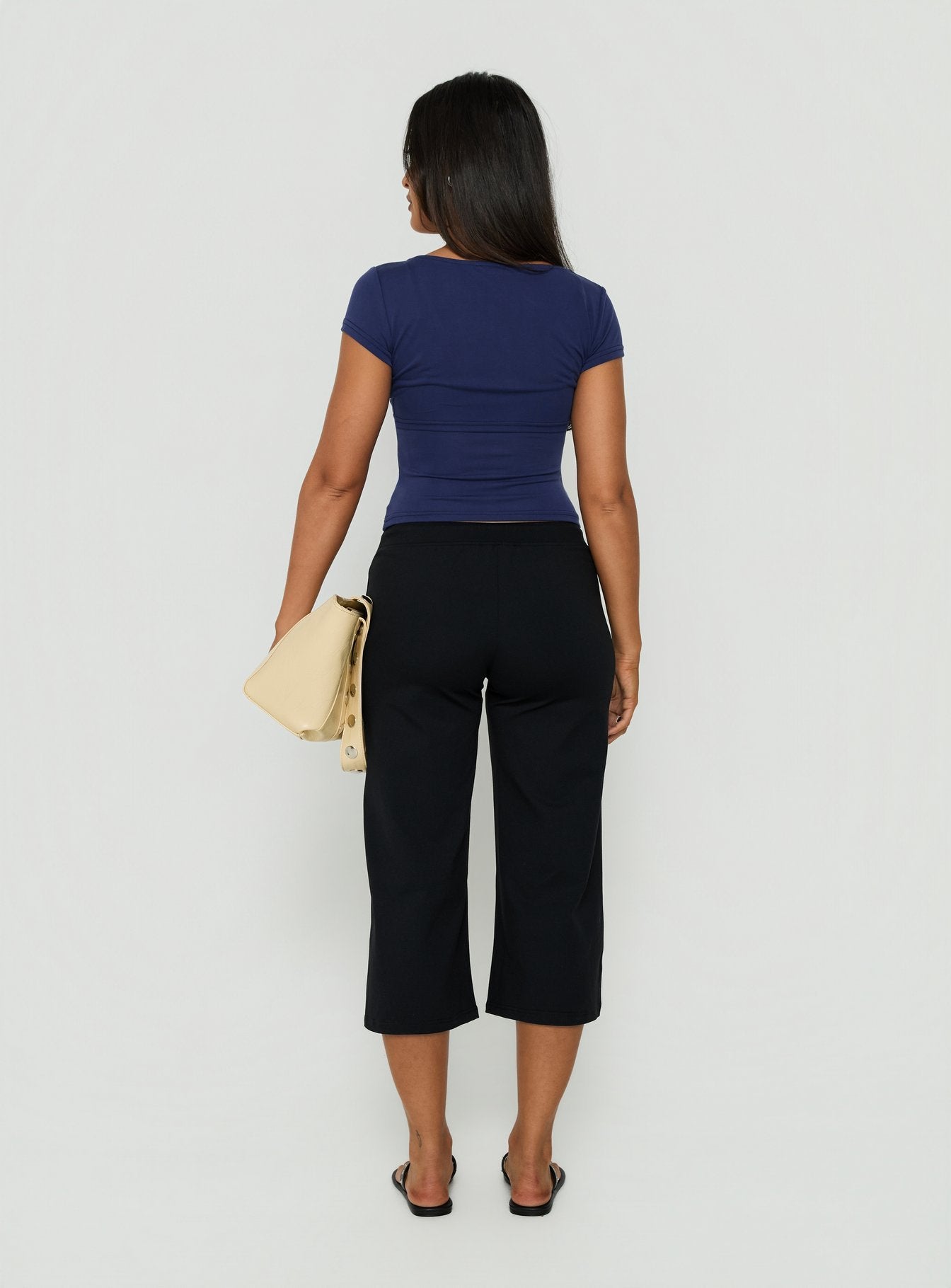 Shop Kallora Low Rise Wide Leg Capris Black womens-regular-pants back view of model wearing Princess Polly
