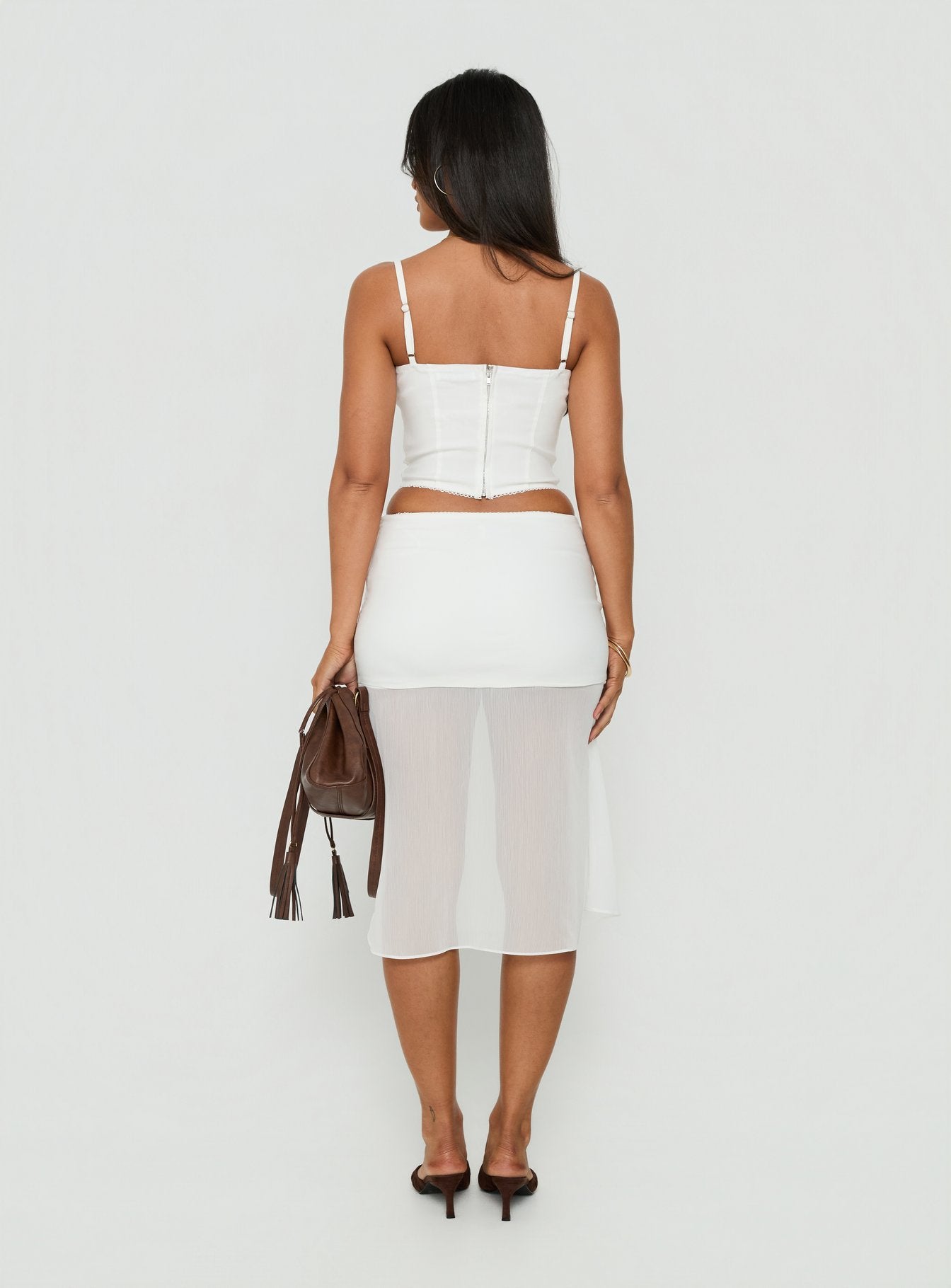 Styled beautifully the Camy Sheer Panelled Midi Skirt White womens-skirts in midi length back view of model wearing Princess Polly