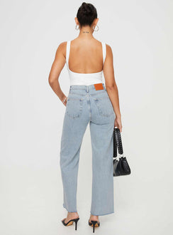back view of model wearing Princess Polly Fawcett Jeans Light Wash Denim Petite High Waisted 