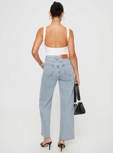 back view of model wearing Princess Polly Fawcett Jeans Light Wash Denim Petite High Waisted 