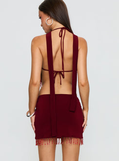 back view of model wearing Princess Polly Ginah Bead Tassel Mini Skirt Red Mini Skirts 