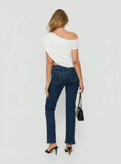 Featuring the Harpor Mid Rise Slim Skinny Jean Mid Blue Wash womens-jeans with belt back view of model wearing Princess Polly