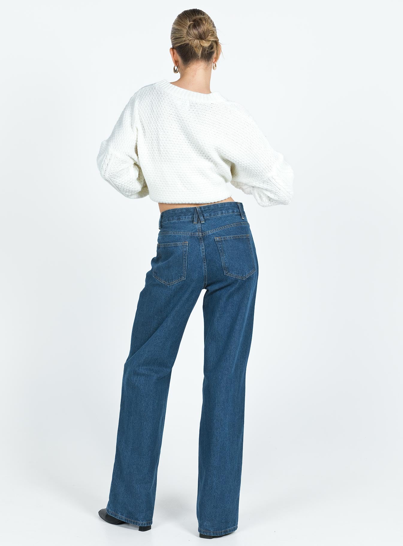 Front view of model wearing  front Princess Polly Mid Rise  Top Model Jeans Dark Denim