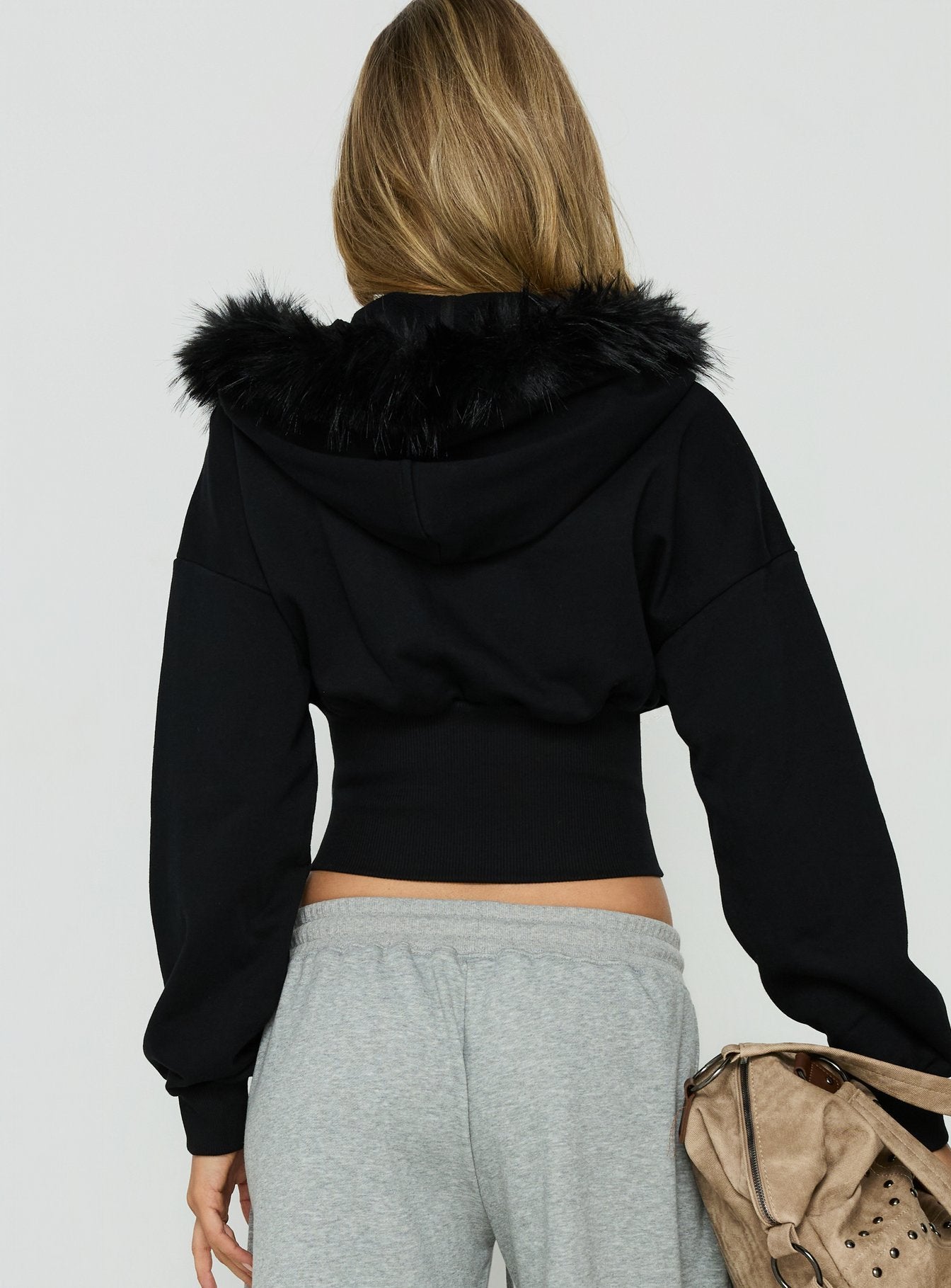 Explore the Ramonda Faux Fur Hooded Jumper Black womens-jumpers in short length back view of model wearing Princess Polly