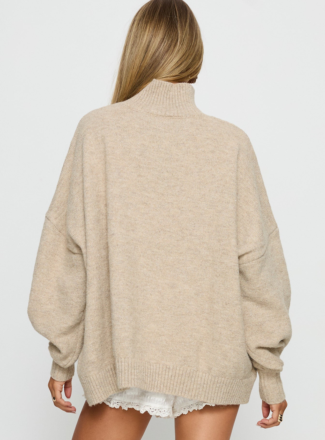 back view of model wearing Princess Polly Patrizia Funnel Neck Knit Sweater Beige 