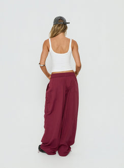 Introducing the Mankind Baggy Cargo Pants Red womens-regular-pants in maroon mid-rise back view of model wearing Princess Polly
