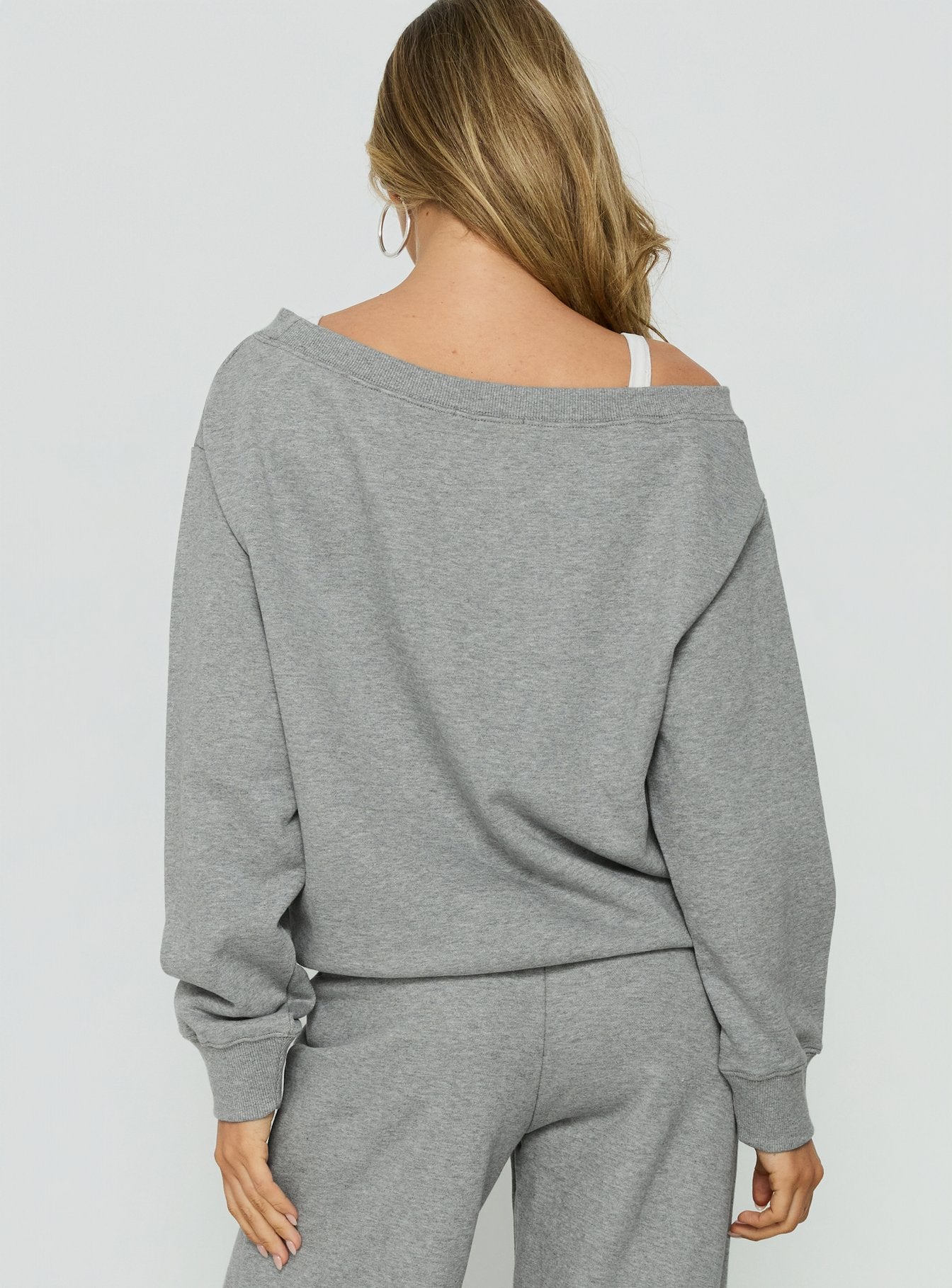 Presenting the Wellness Off The Shoulder Jumper Dark Grey Marle in womens-jumpers with long length, boat neckline and oversized fit back view of model wearing Princess Polly