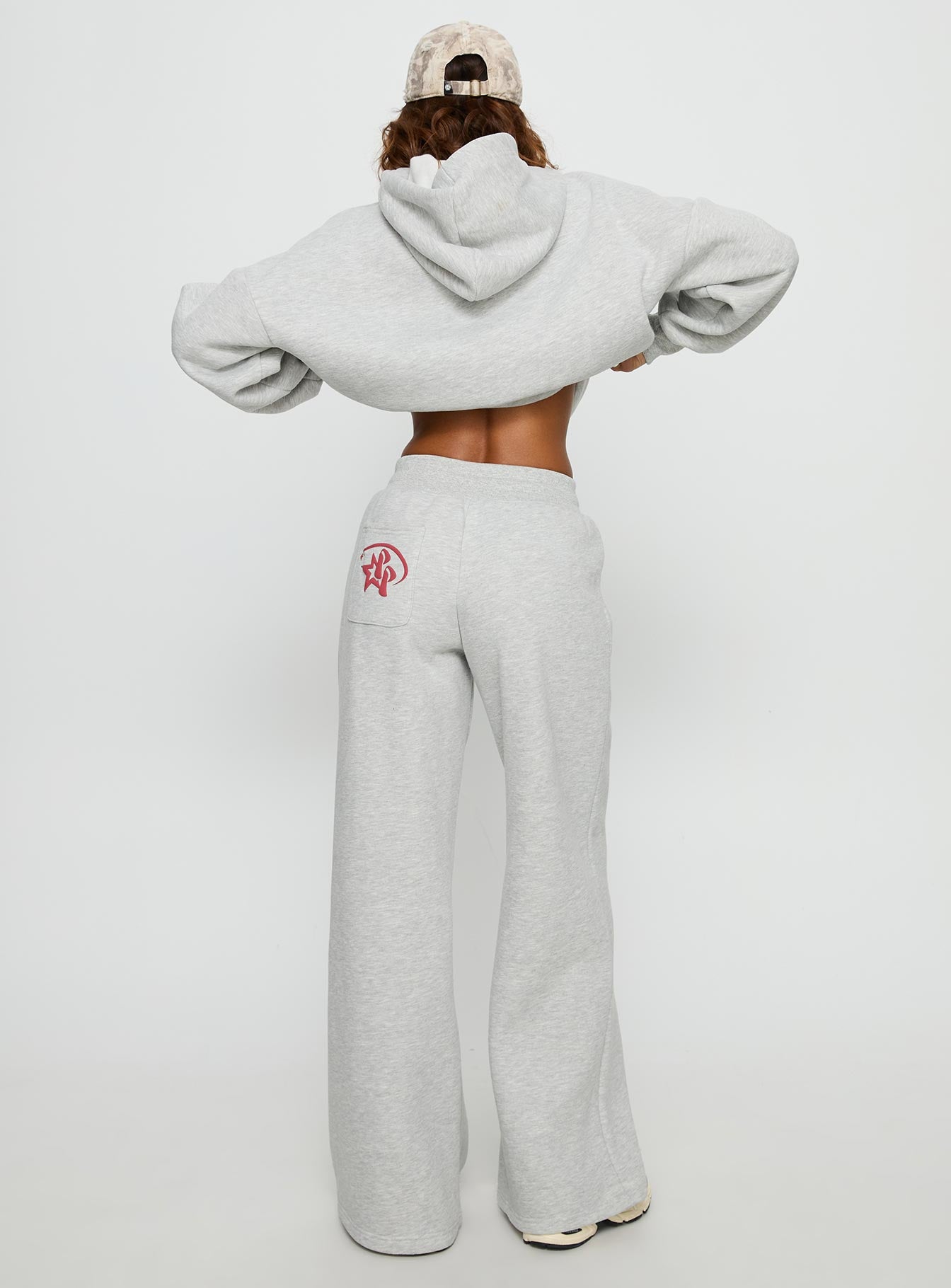 back view of model wearing Princess Polly Princess Polly Stargirl Wide Leg Sweat Pants Grey Marle High Rise Pants Pants 