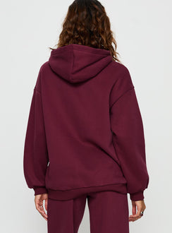 Elegantly presented Stargirl Zip Through Jumper in burgundy womens jumpers with long oversized fit, graphic print and hood back view of model wearing Princess Polly