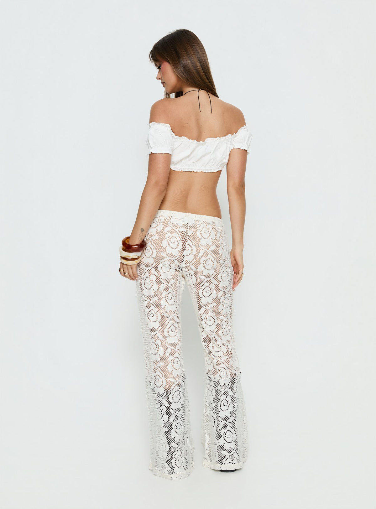 back view of model wearing Princess Polly Rosadonna Lace Flare Pants Cream Mid Rise Pants 