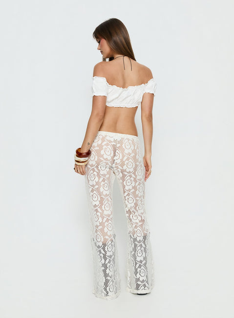 back view of model wearing Princess Polly Rosadonna Lace Flare Pants Cream Mid Rise Pants 