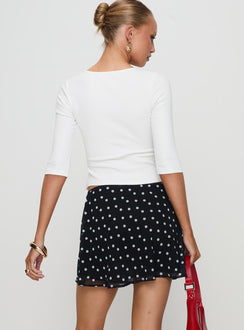 back view of model wearing Princess Polly Dapple Bias Mini Skirt Black Polka Dot Mini Skirts Skirts 