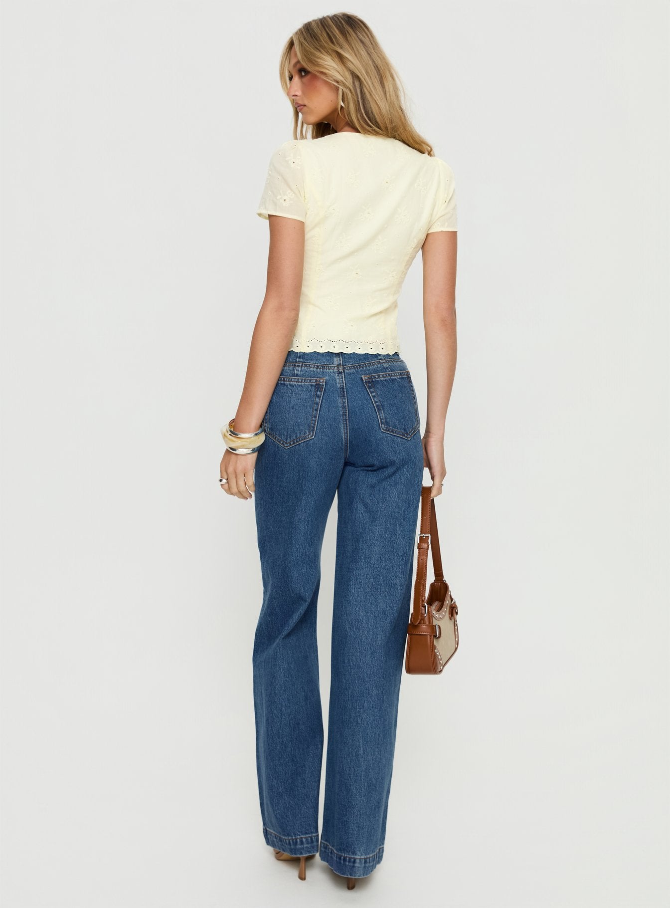 back view of model wearing Princess Polly Goldie High Rise Wide Leg Jeans Mid Blue Wash High Rise Jeans 