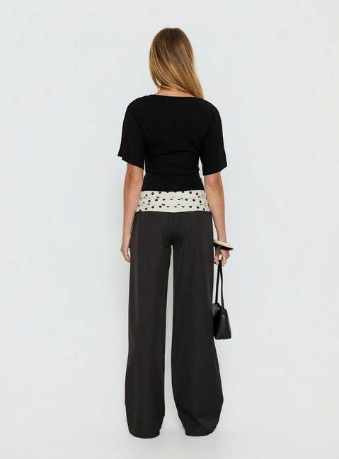 back view of model wearing Princess Polly Seneca Wrap Pants Charcoal Polka Dot Mid Rise Pants 