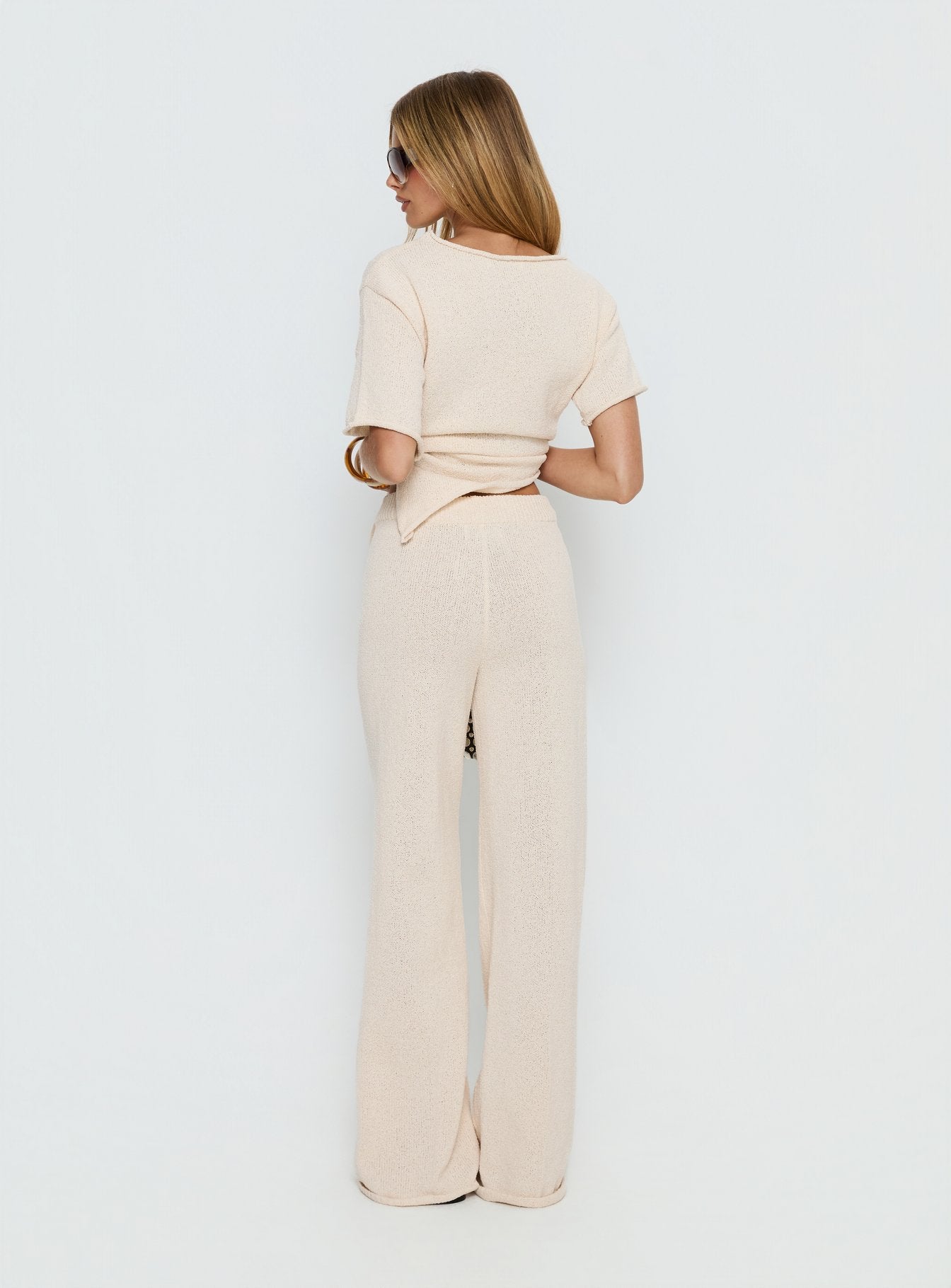 back view of model wearing Princess Polly Calisse Knit Wide Leg Pants Beige High Rise Pants 