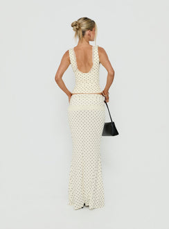 Showcasing the Zespri Jersey Maxi Skirt Cream Polka Dot womens-skirts with fitted a-line silhouette and lace hem back view of model wearing Princess Polly
