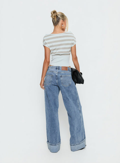 back view of model wearing Princess Polly Ramos Diamante Low Rise Wide Leg Jeans Washed Mid Blue Low Rise Jeans 