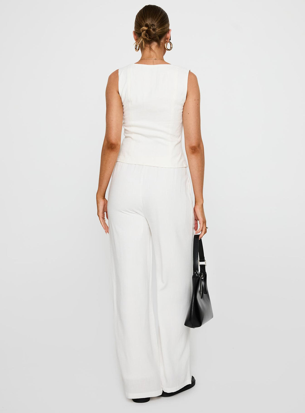 back view of model wearing Princess Polly Parklea Pants White Tall 