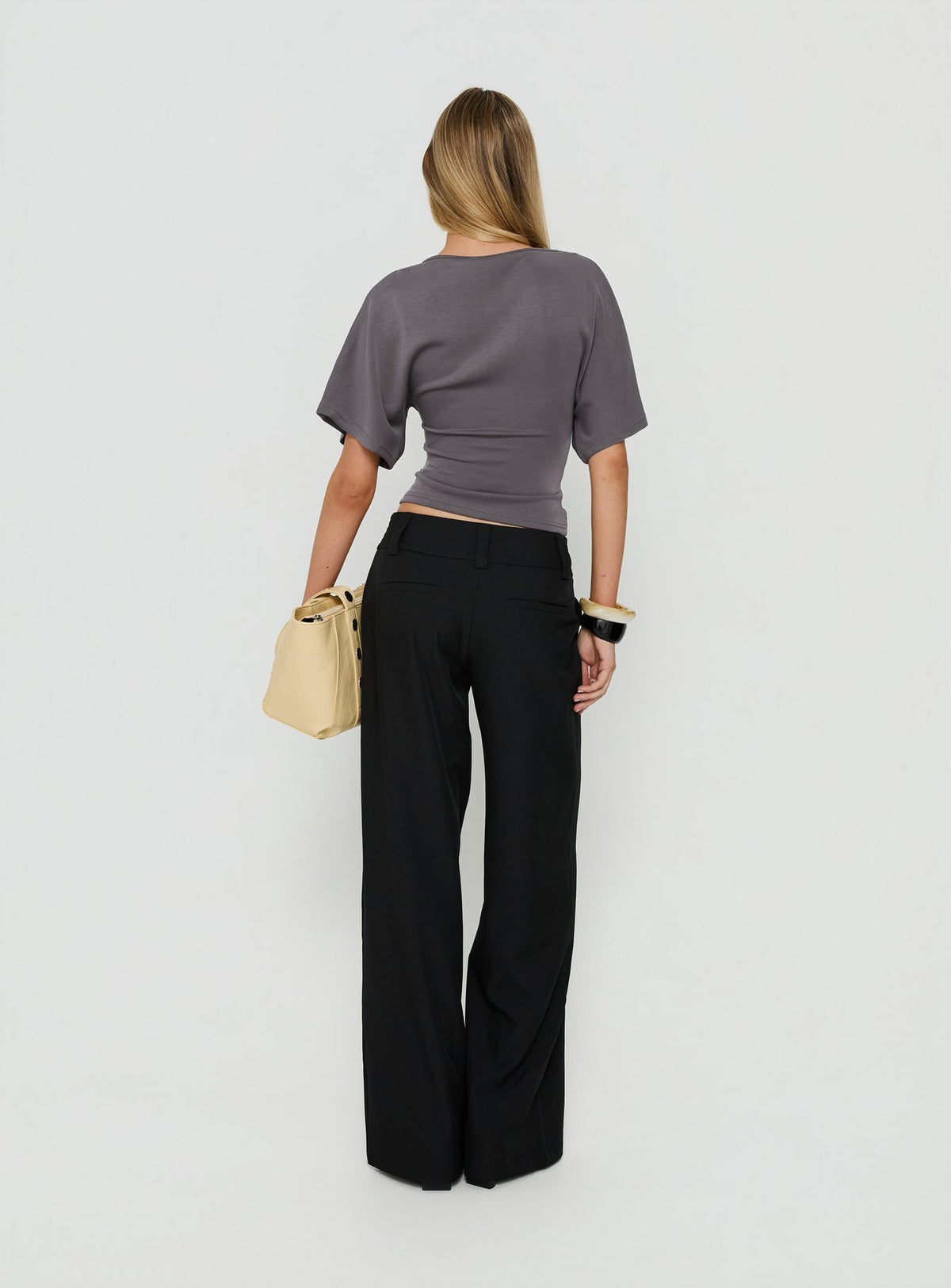 Presenting the Cedars Low Rise Pant Black womens-regular-pants with low-rise back view of model wearing