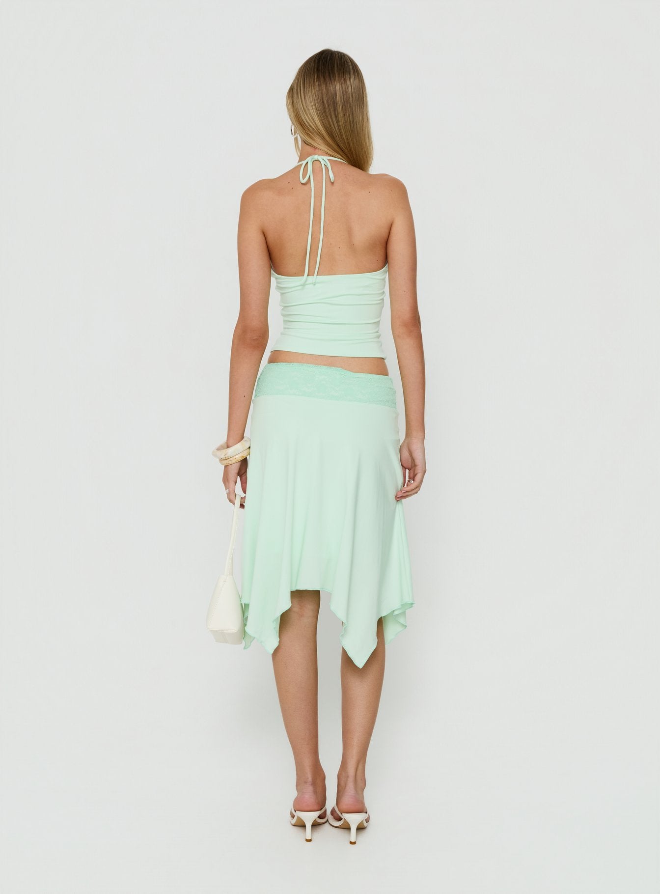 Explore the Natabelle Lace Detail Midi Skirt in Mint, a womens-skirts design with asymmetry and fitted shape back view of model wearing Princess Polly