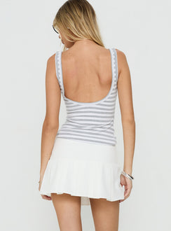 Presenting the Raynah Micro Pleated Mini Skort White in womens-skirts with mini length, solid, a-line shape, and fitted design back view of model wearing Princess Polly
