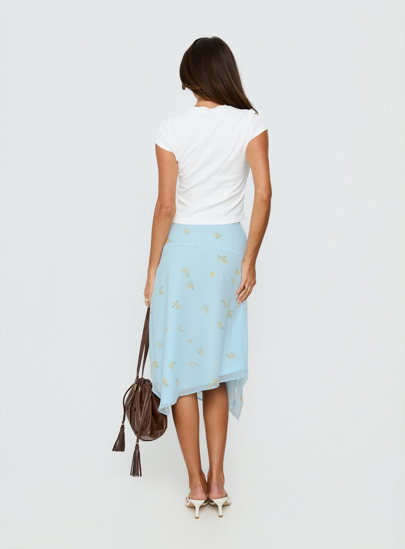 back view of model wearing Princess Polly Daphene Asymmetrical Midi Skirt Blue Floral Midi Skirts 